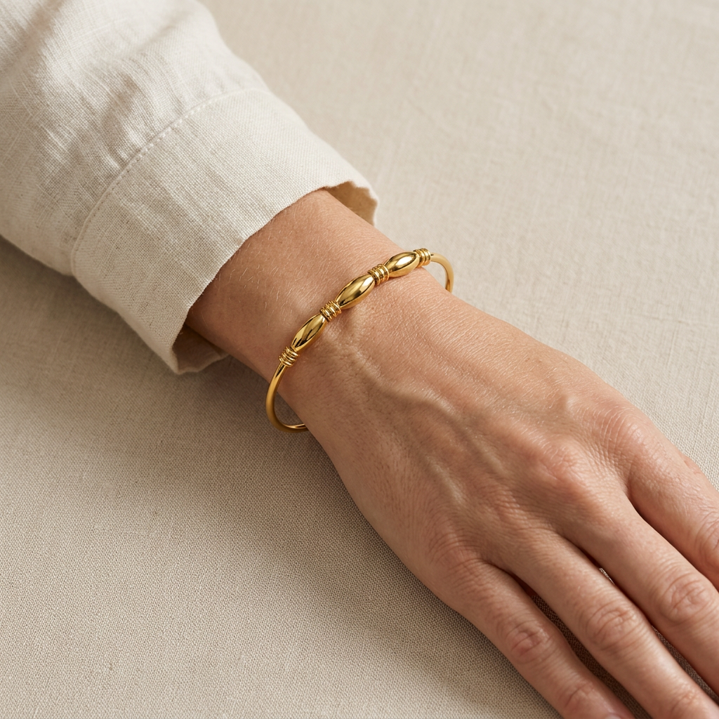 Laurent bangle worn with a cream blouse