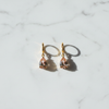 Rory champagne crystal teardrop drop earrings flat lay on white marble