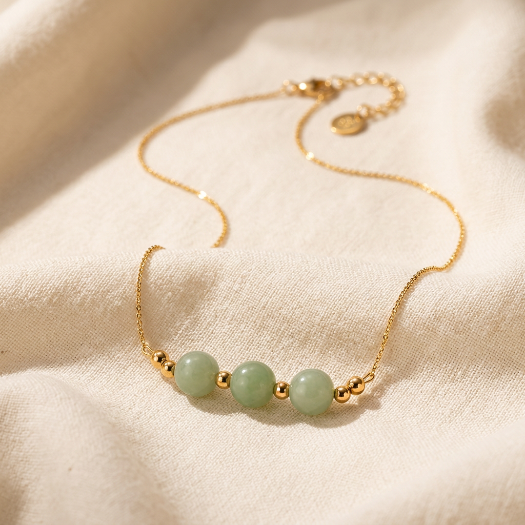 Orla green bead necklace on cream linen