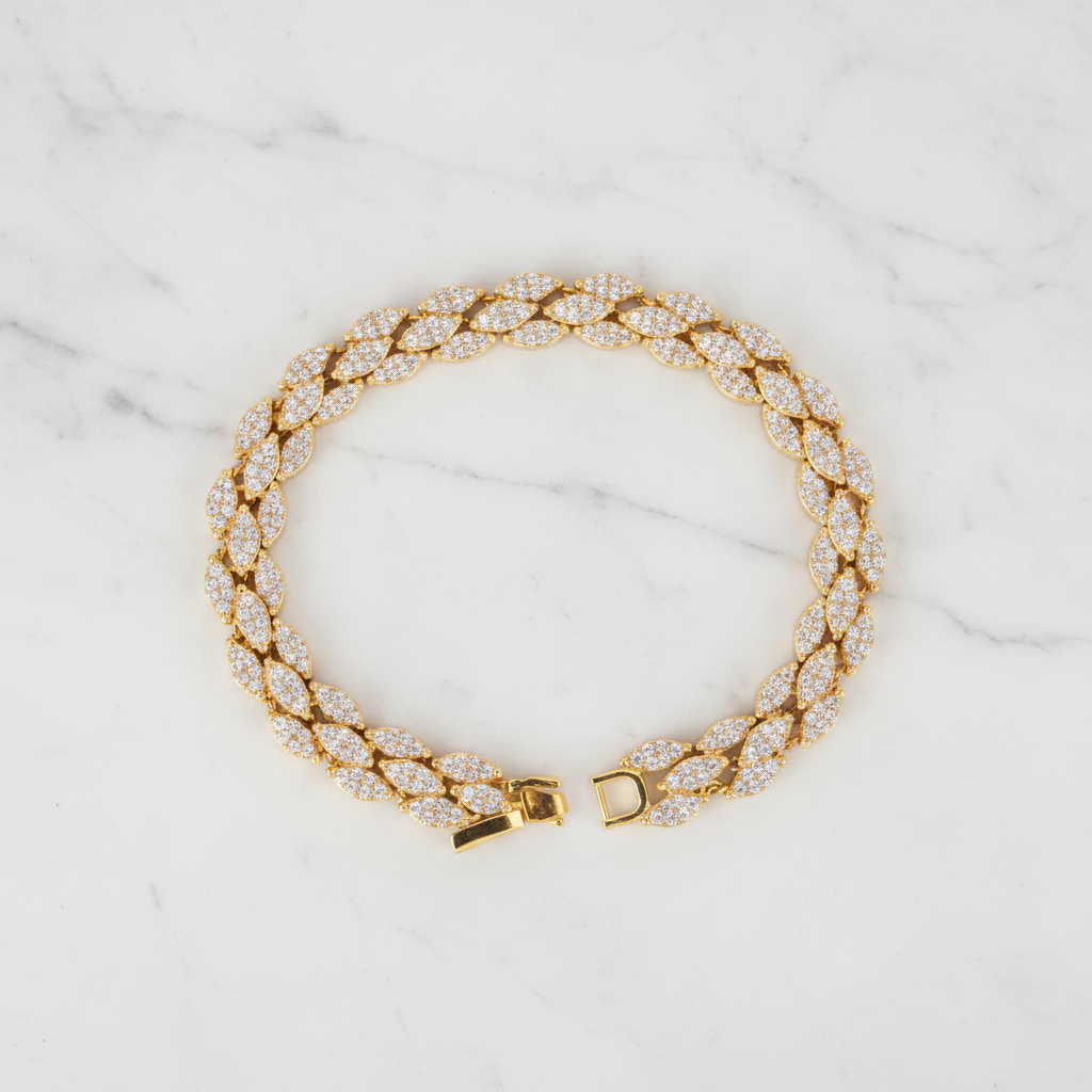Marquise Glow tennis bracelet pave marquise leaflet links flat lay on white marble