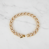 Marquise Glow tennis bracelet pave marquise leaflet links flat lay on white marble