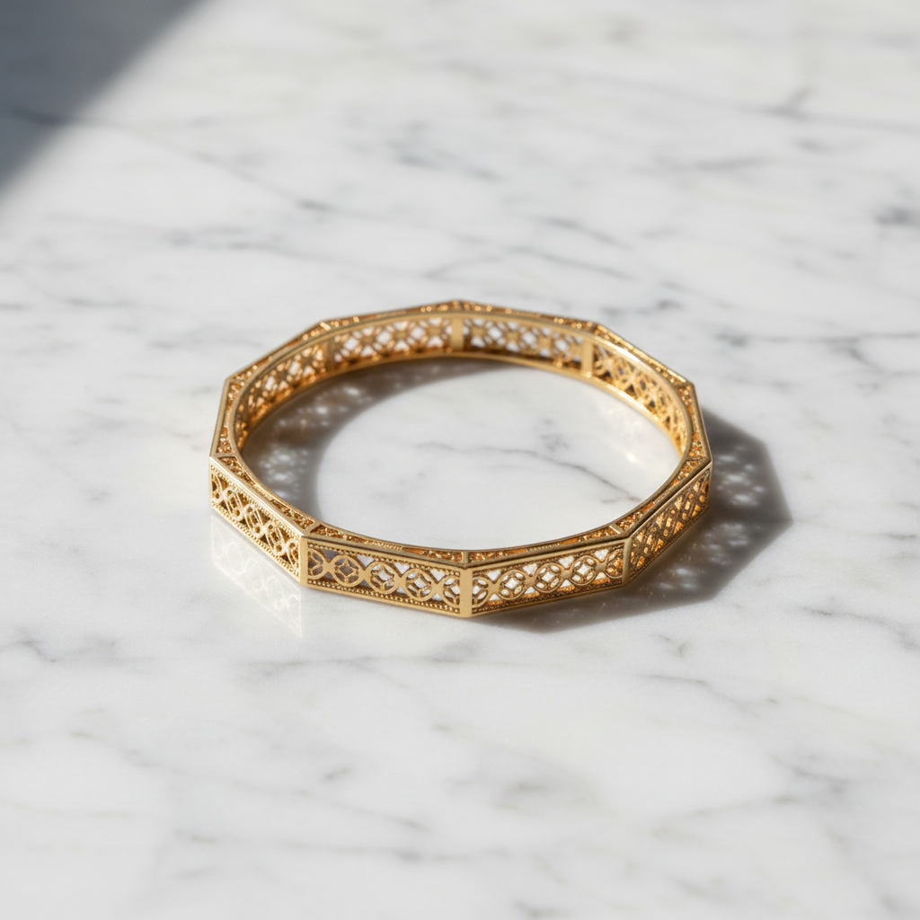 Charlotte gold octagonal quatrefoil filigree bangle flat lay on white marble