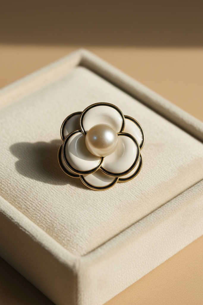 Ivory petal pearl bloom brooch on cream velvet tray display