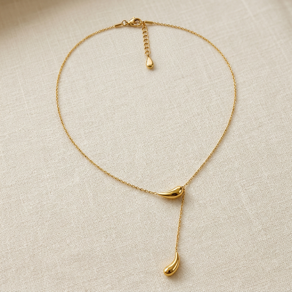 Matteo lariat necklace displayed on cream linen