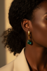 Amelia emerald green stone drop earrings on-ear lifestyle editorial shot