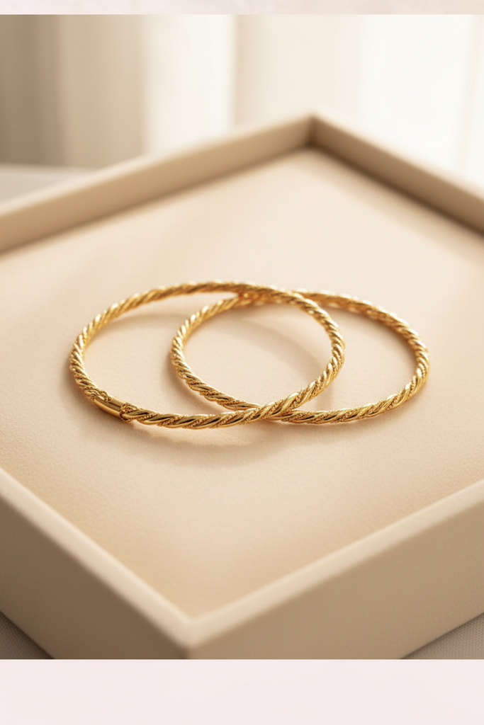 Langley slim closed gold twisted rope bangle cream velvet tray display