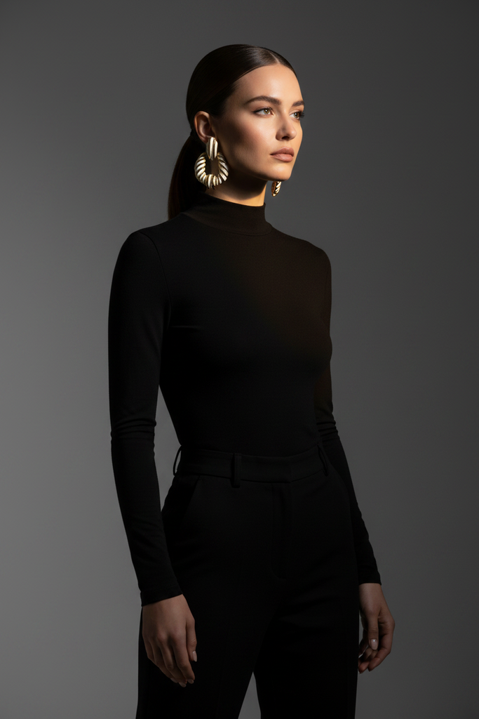 Riley black gold stripe statement earrings styled with sleek all-black outfit