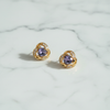 Langlet purple stud earrings flat lay on white marble surface