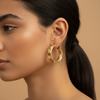 Cannes Sculptural Hoop Earrings - worn on ear side profile close-up