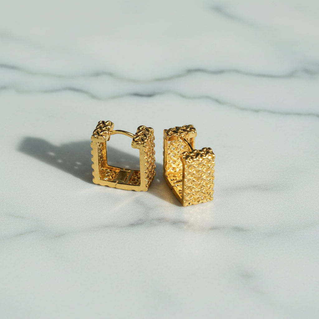 Cara Square Hoop Earrings flat lay on white marble