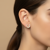 Fallon Horseshoe Stud Earrings - worn on ear side profile close-up