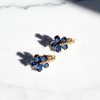 Verona Blossom Hoops sapphire blue floral crystal hoop earrings flat lay on white marble