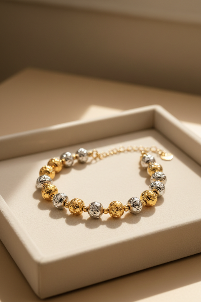 Oslo two-tone diamond-cut ball bracelet cream velvet tray display