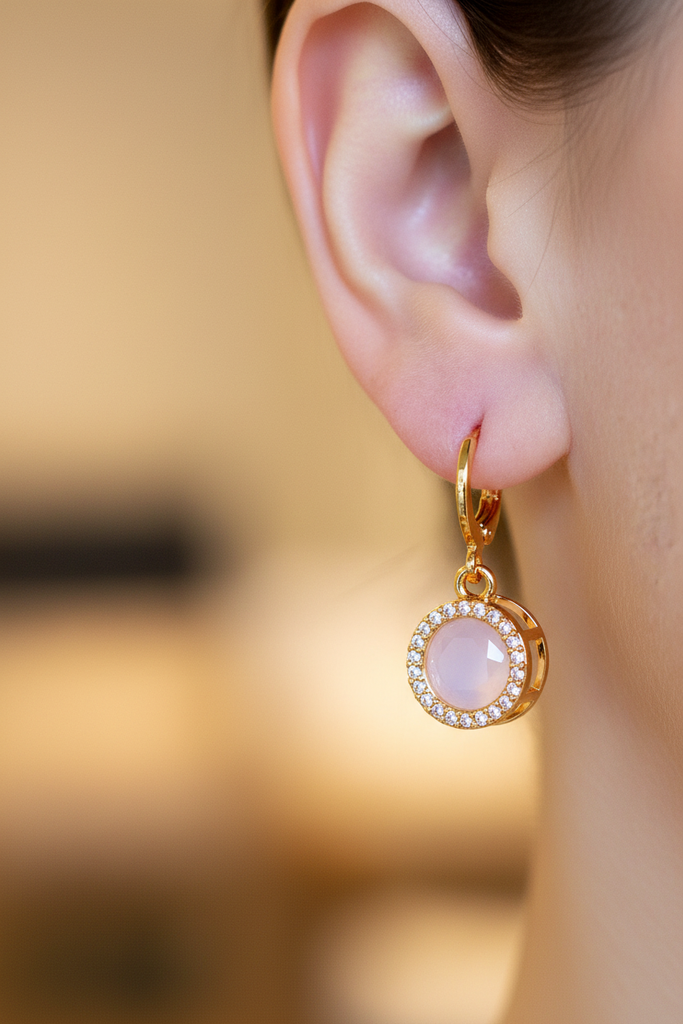 Ines pink stone halo drop earrings on-ear lifestyle shot
