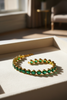 Chepi oval emerald tennis bracelet cream velvet tray display