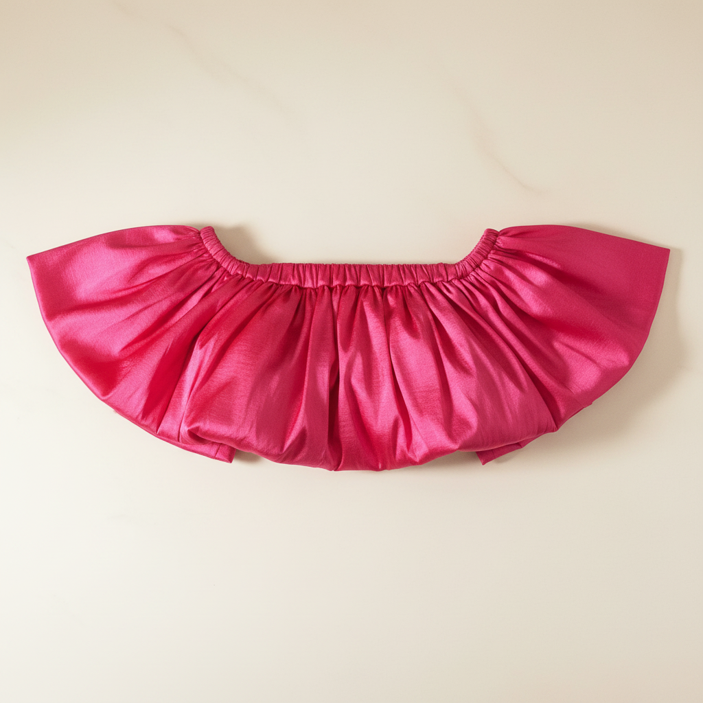 Amelie Pink Flutter Top - flat lay on cream surface