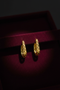 Tallulah gold filigree huggie hoop earrings on dark velvet tray