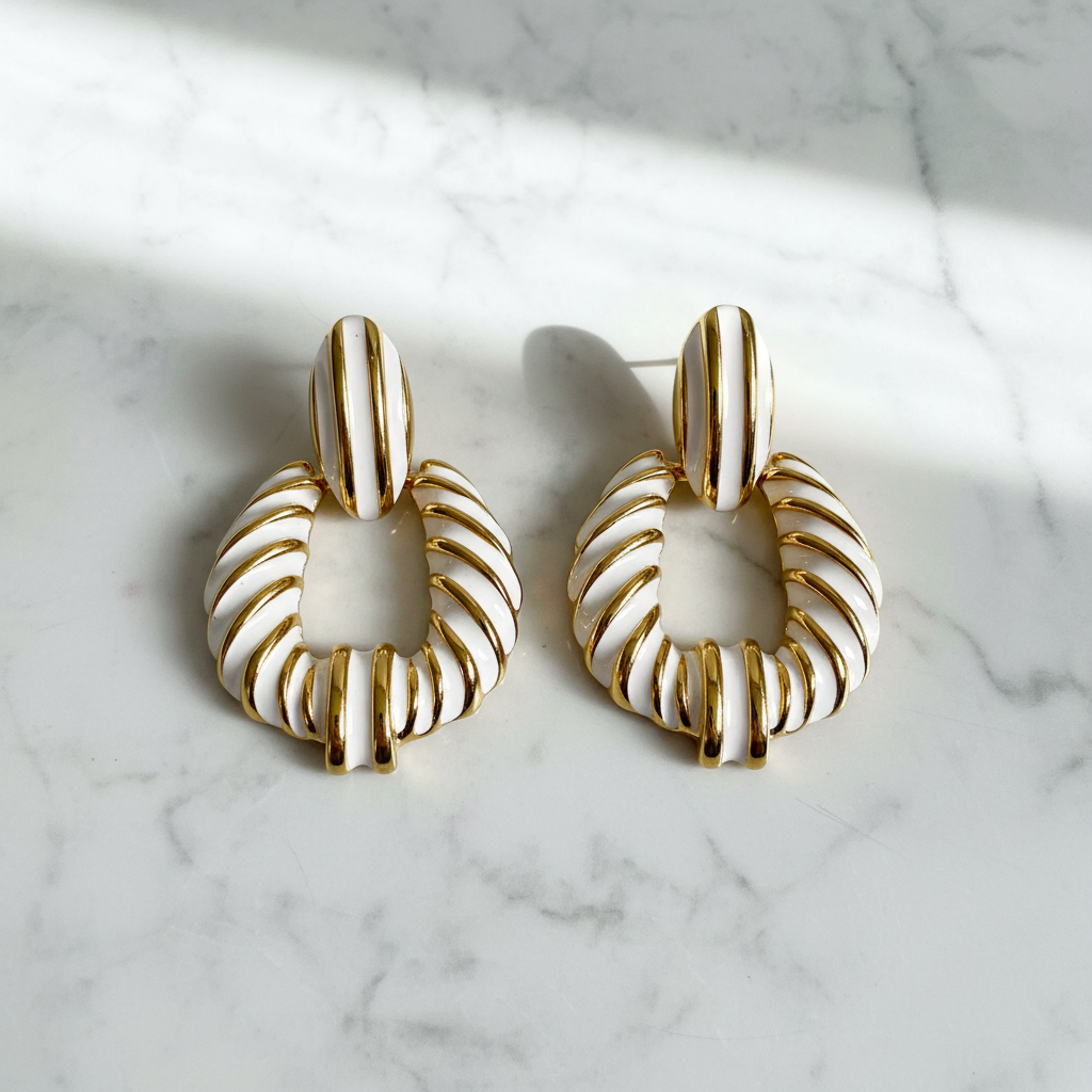 Riley white gold stripe statement earrings flat lay on white marble