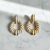 Riley white gold stripe statement earrings flat lay on white marble