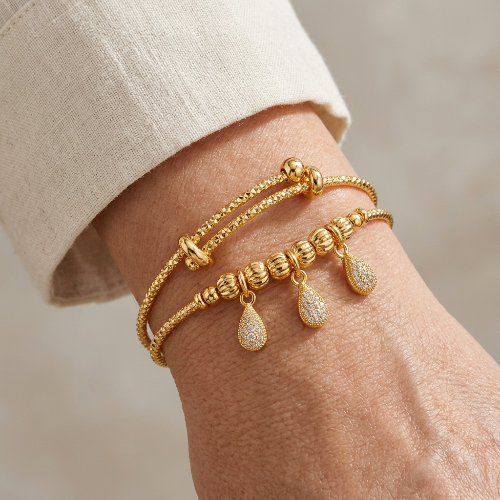 Ophelia bracelet worn on a wrist with a cream blouse