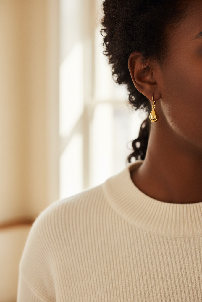 Winona polished gold teardrop dangle earrings styled with casual chic everyday outfit