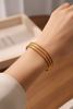 Bianca triple-row gold cuff bracelet on-wrist lifestyle