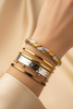 Tuscany two-tone gold and silver twisted rope-and-braid cuff bracelet stacked styling