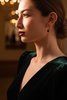 Isabella gold fringe black stone earrings styled with evening outfit