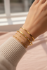 Doha two-tone gold bangle stacked bracelet styling