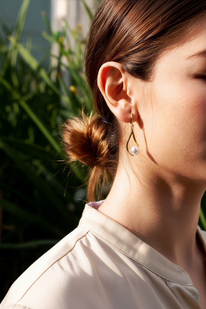 Emerson gold swirl pearl drop earrings styled with everyday chic outfit