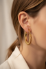 Monaco gold textured rope hoop earrings side profile close-up on ear