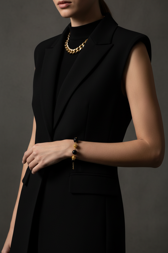 Elizabeth black resin and gold filigree ball bracelet editorial all-black outfit styling