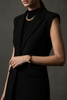 Elizabeth black resin and gold filigree ball bracelet editorial all-black outfit styling