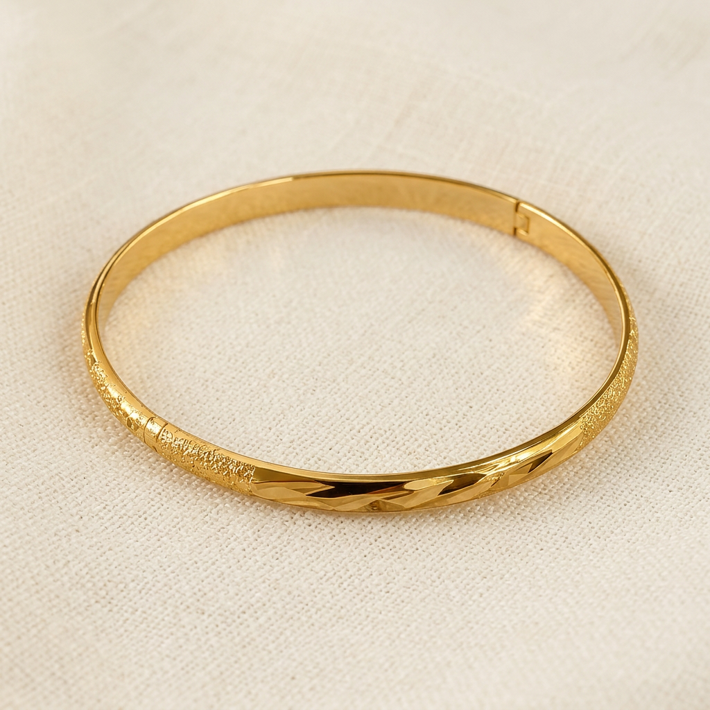 Portia textured bangle displayed on linen