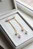 Olivia pearl drop earrings on white velvet tray