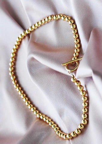 The "Pauline" Drop Pearl Larynx Necklace with Leaf Detailing